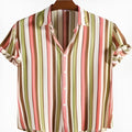 Man wearing a digitally printed short sleeve polyester shirt in a solid colour.