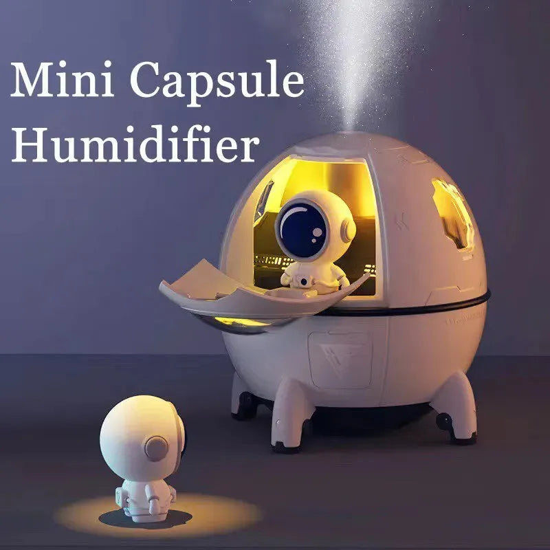 Astronaut-themed desktop USB humidifier with colourful LED lights and water tank.