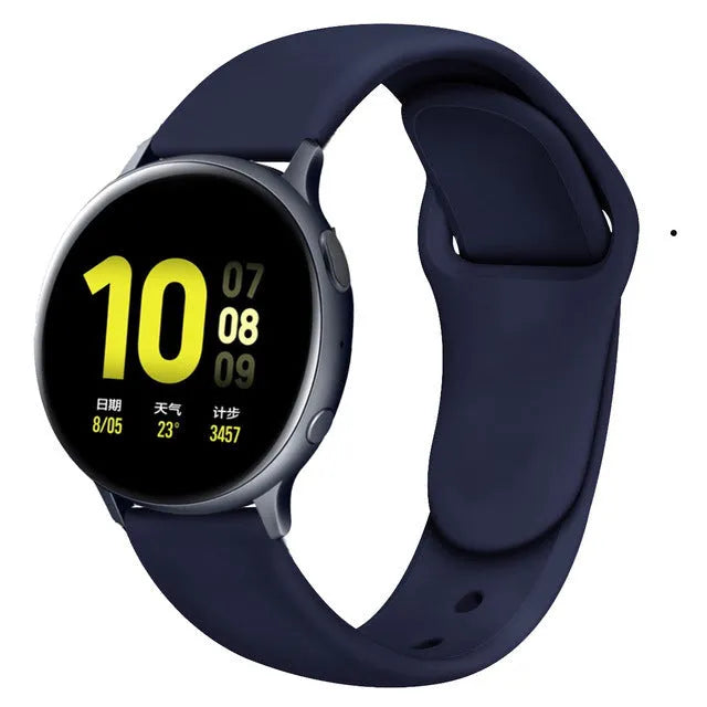Samsung Galaxy Active 2 watch with a purple reverse buckle silicone strap on a wrist.