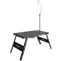 Folding camping cooking table with integrated barbecue surface in black