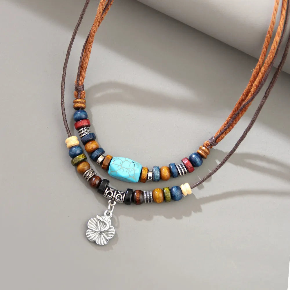 Men's wooden bead necklace with turquoise wax rope and alloy geometric flower pendant in retro design
