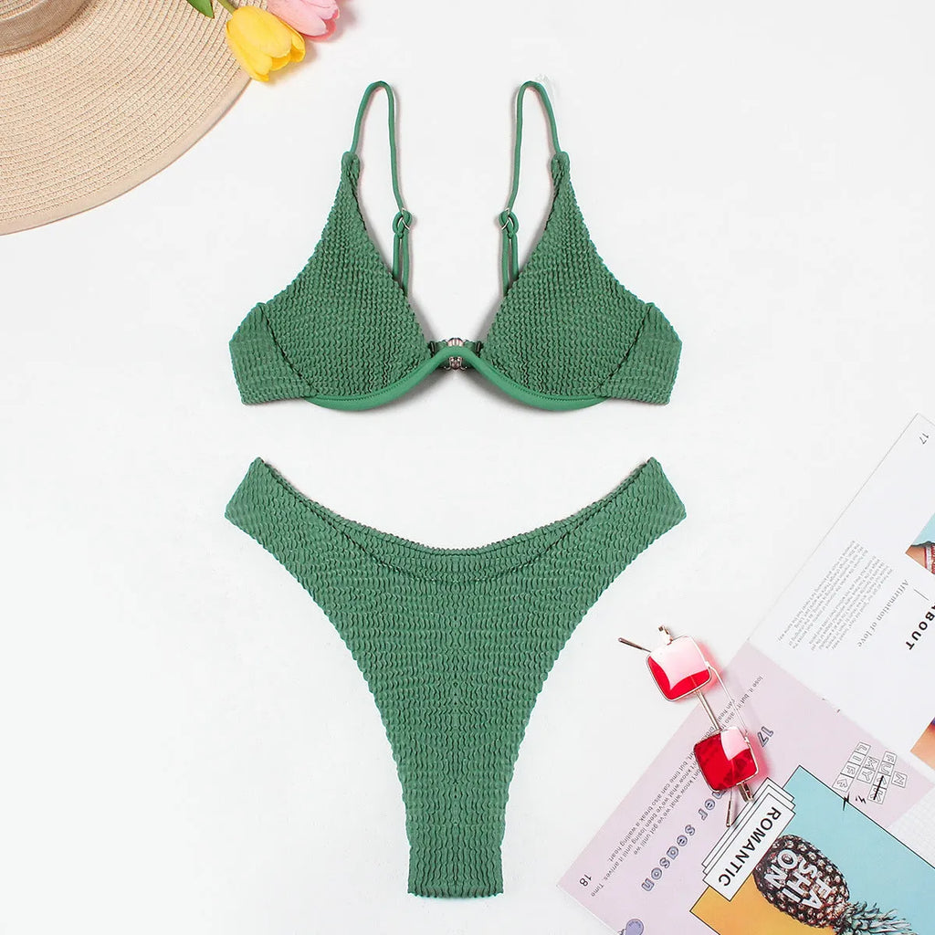 Women's green bikini swimsuit with ruffle trim top and split skirt bottom