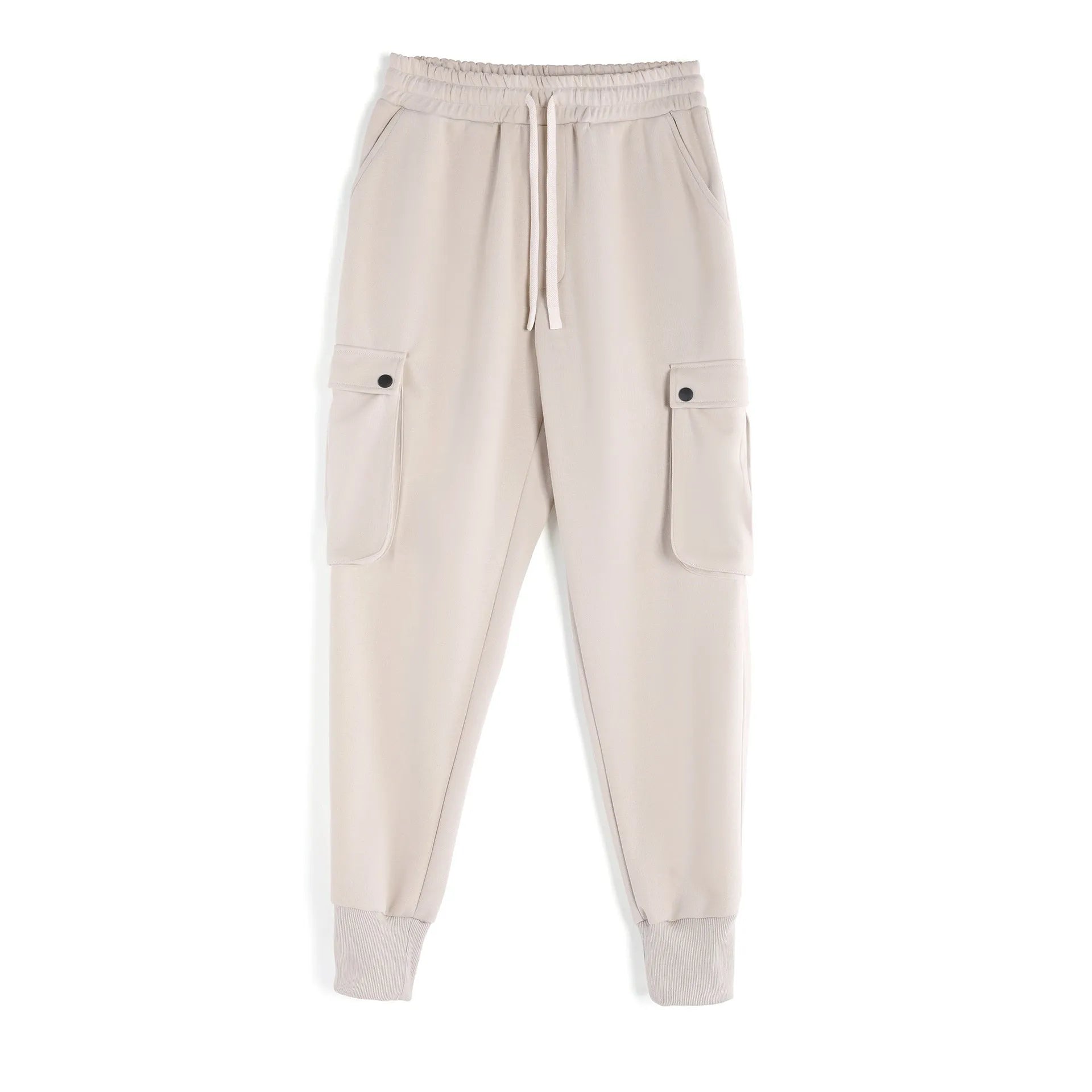 Men's loose-fit cotton sports trousers in apricot colour with ankle ties and multiple pockets, laid flat.