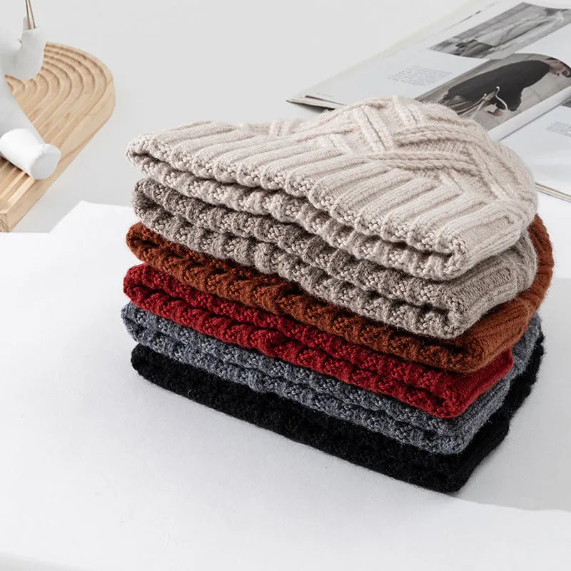 Wool knitted dome hat for women in ankela red with totem detailing.