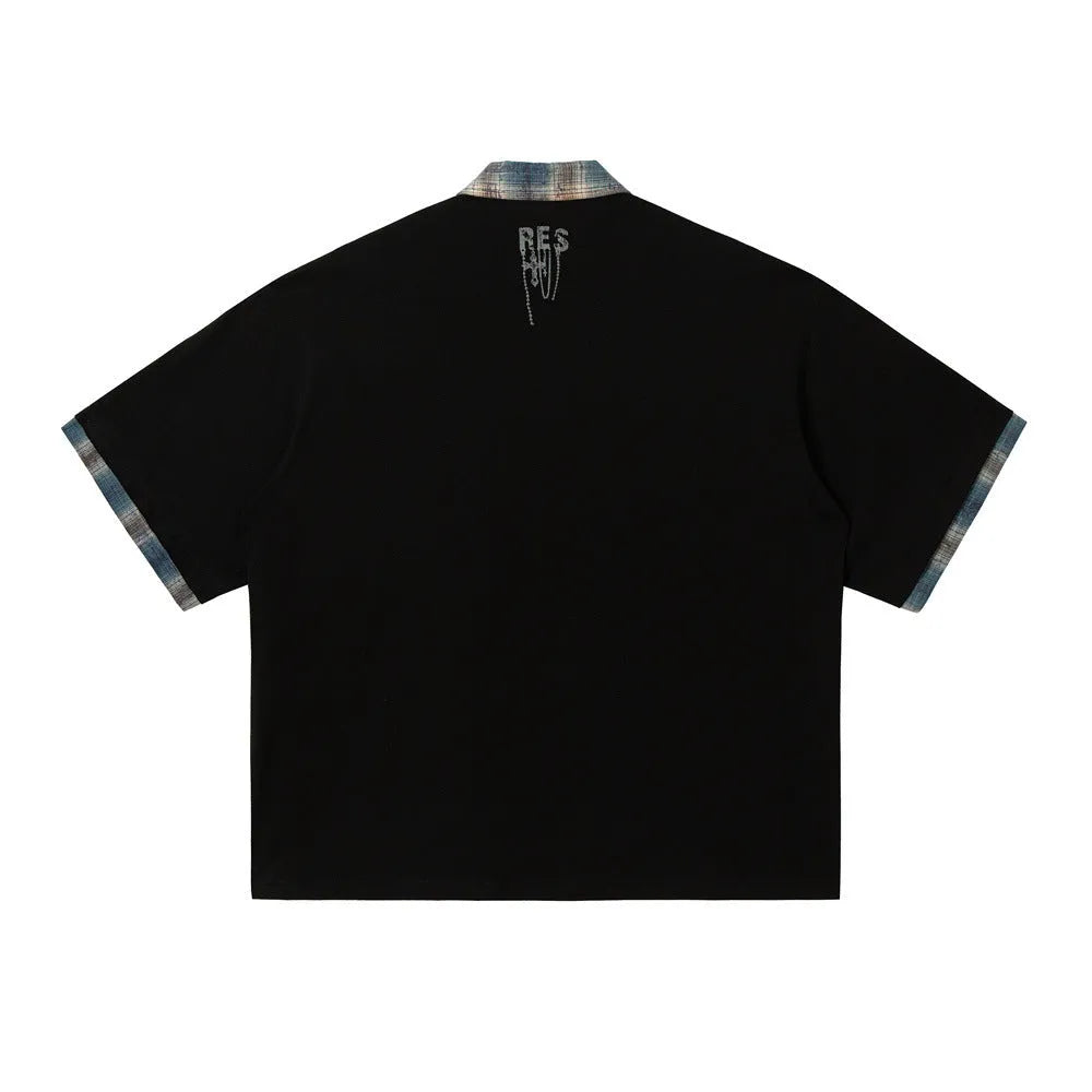Men's loose blue short-sleeved top with a graffiti-style print on the lapel and an asymmetric hem.