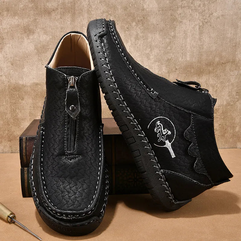 Men's black slip-on loafers with a round toe and low rubber sole.