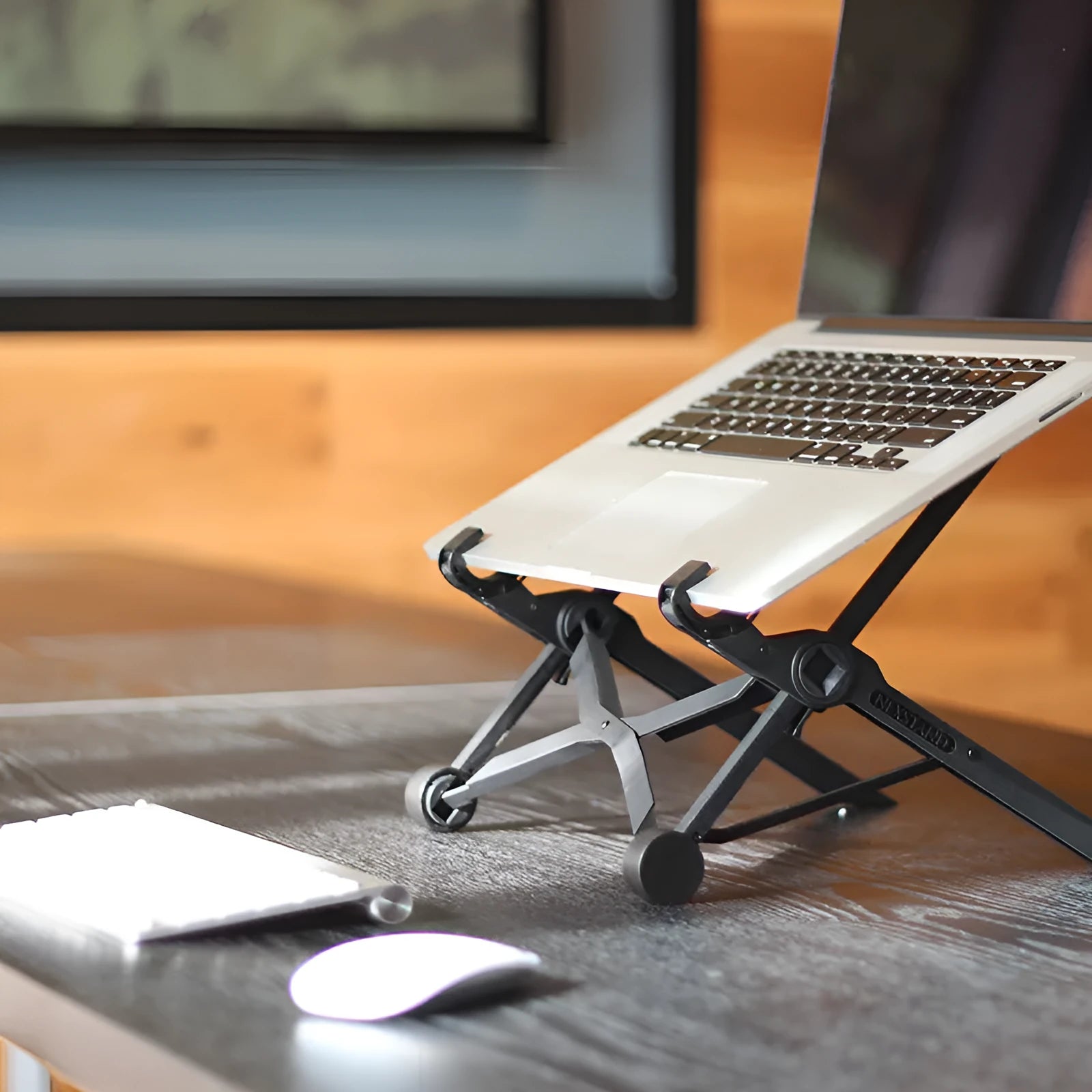 Black foldable portable laptop stand shown with its nylon carry bag and gaskets