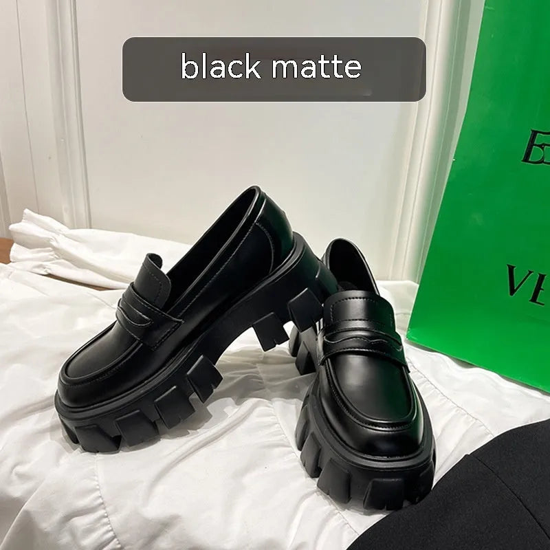 British style wide fit patent leather loafers with a rubber sole and muffin heel base.
