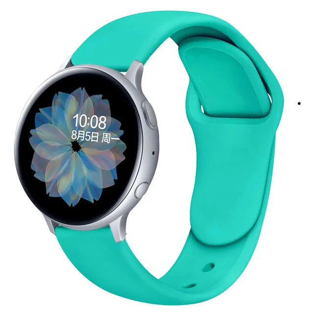 Samsung Galaxy Active 2 watch with a purple reverse buckle silicone strap on a wrist.