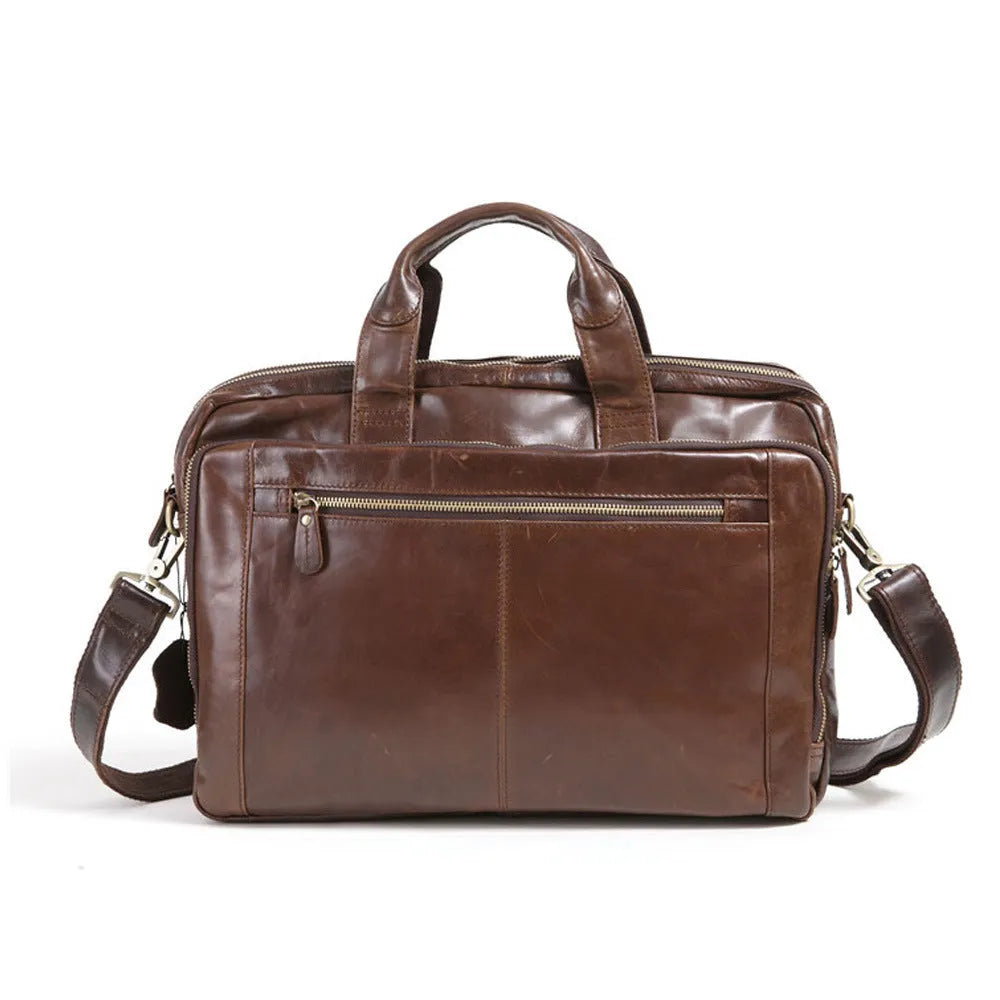 Brown leather men's business briefcase with laptop compartment showing cowhide texture