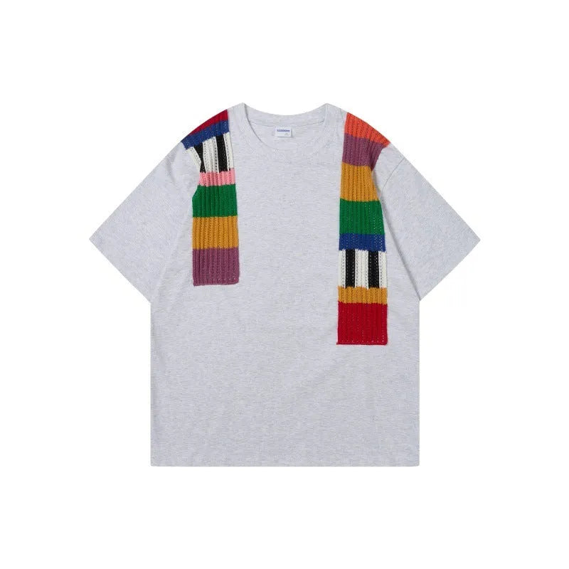 Cotton pullover top with colour contrast patchwork design showing letter patterns, loose fit with short sleeves