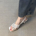 Women's light brown retro sandals with thin cross straps, square toe, and an ankle buckle on a 3-6cm heel.
