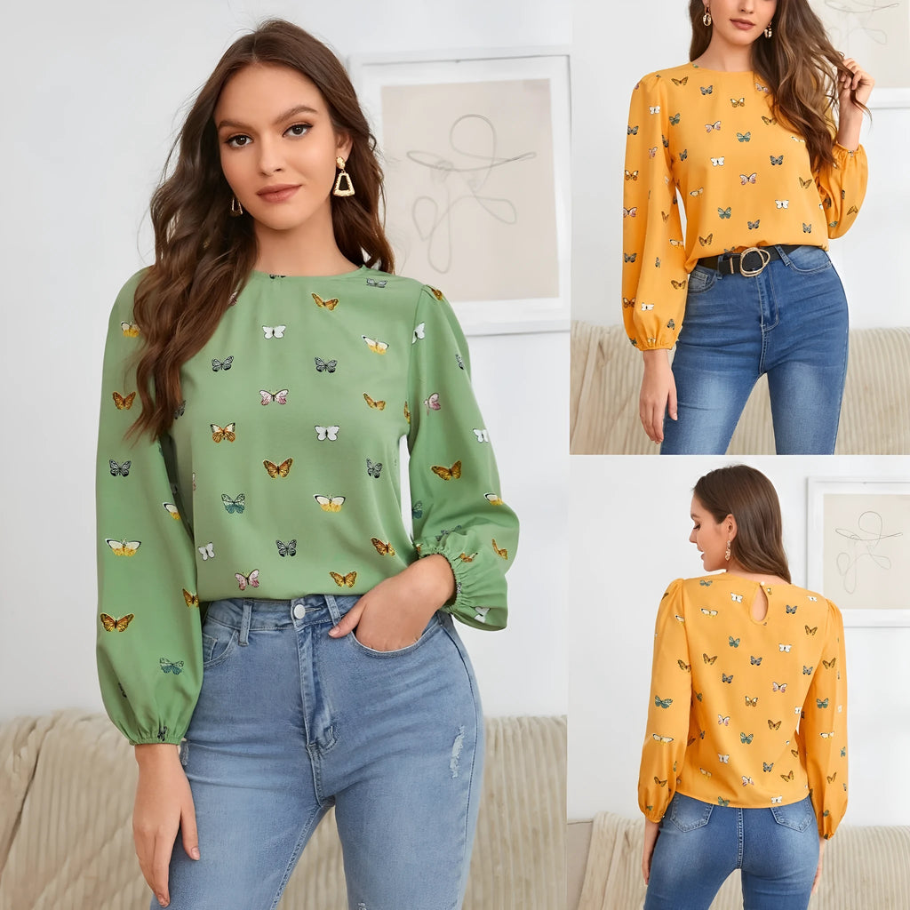 Green women's long-sleeved shirt with butterfly print, showing loose fit and long sleeves.