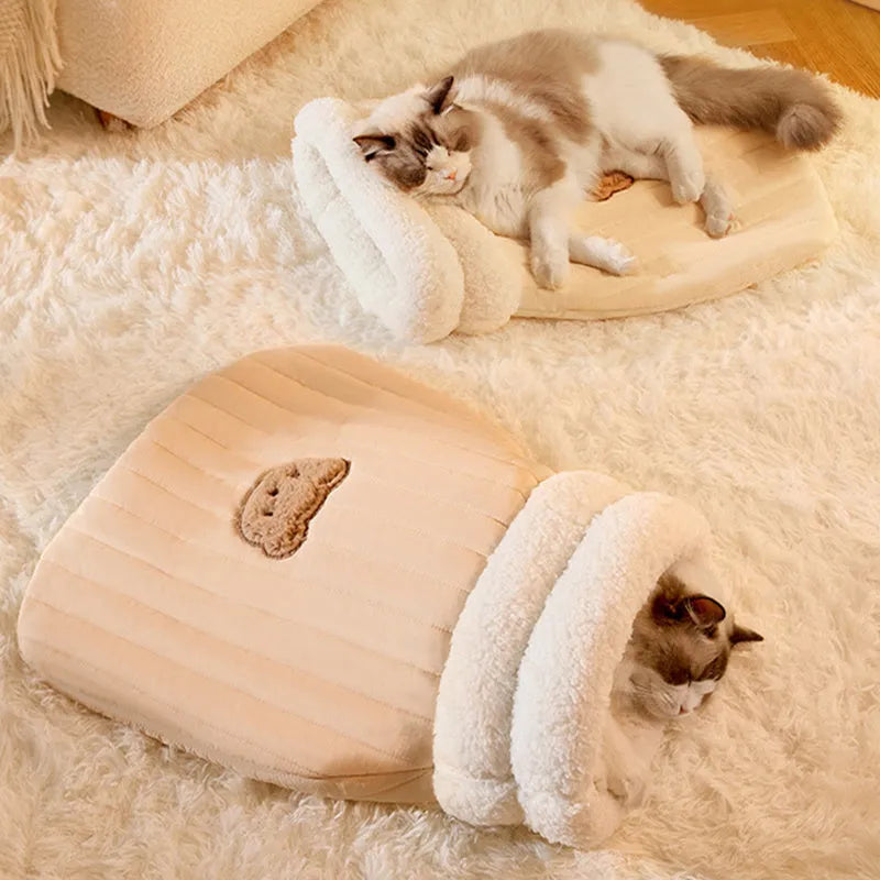Cat sleeping bag nest with fleece fabric exterior and bear pattern in light brown colour