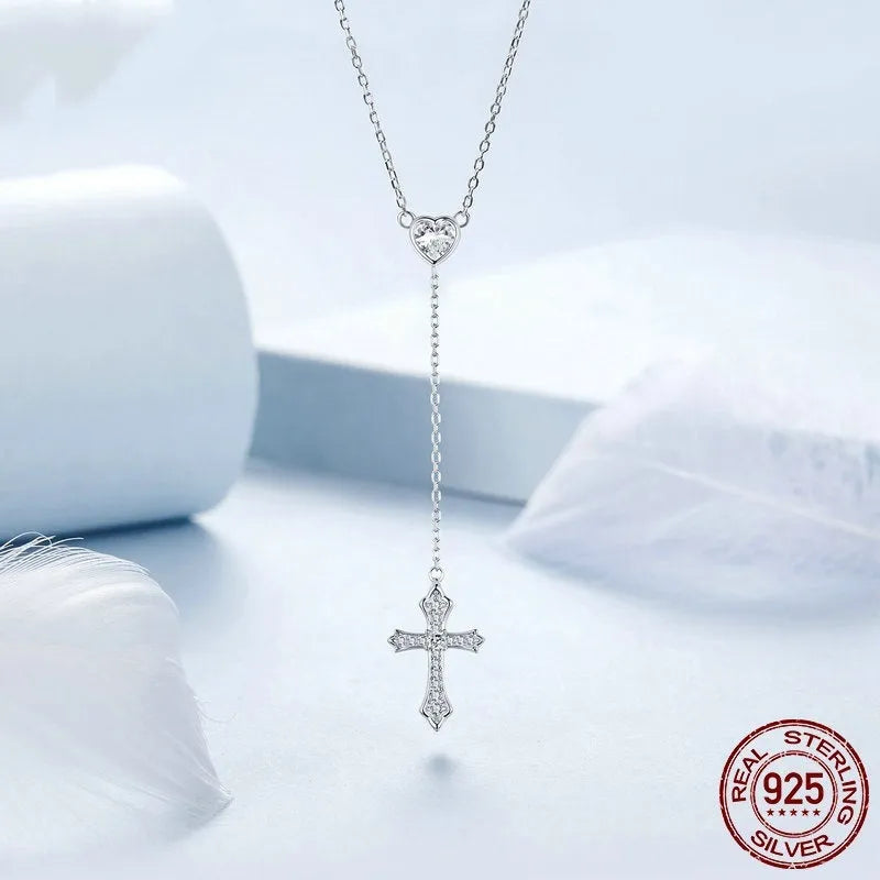 Silver Love Cross pendant necklace with O-ring chain on BSN384 colour background