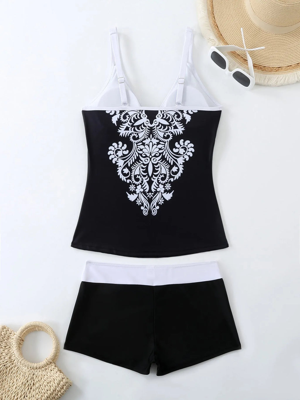Women's plus size printed two-piece swimsuit set in black or rose red.