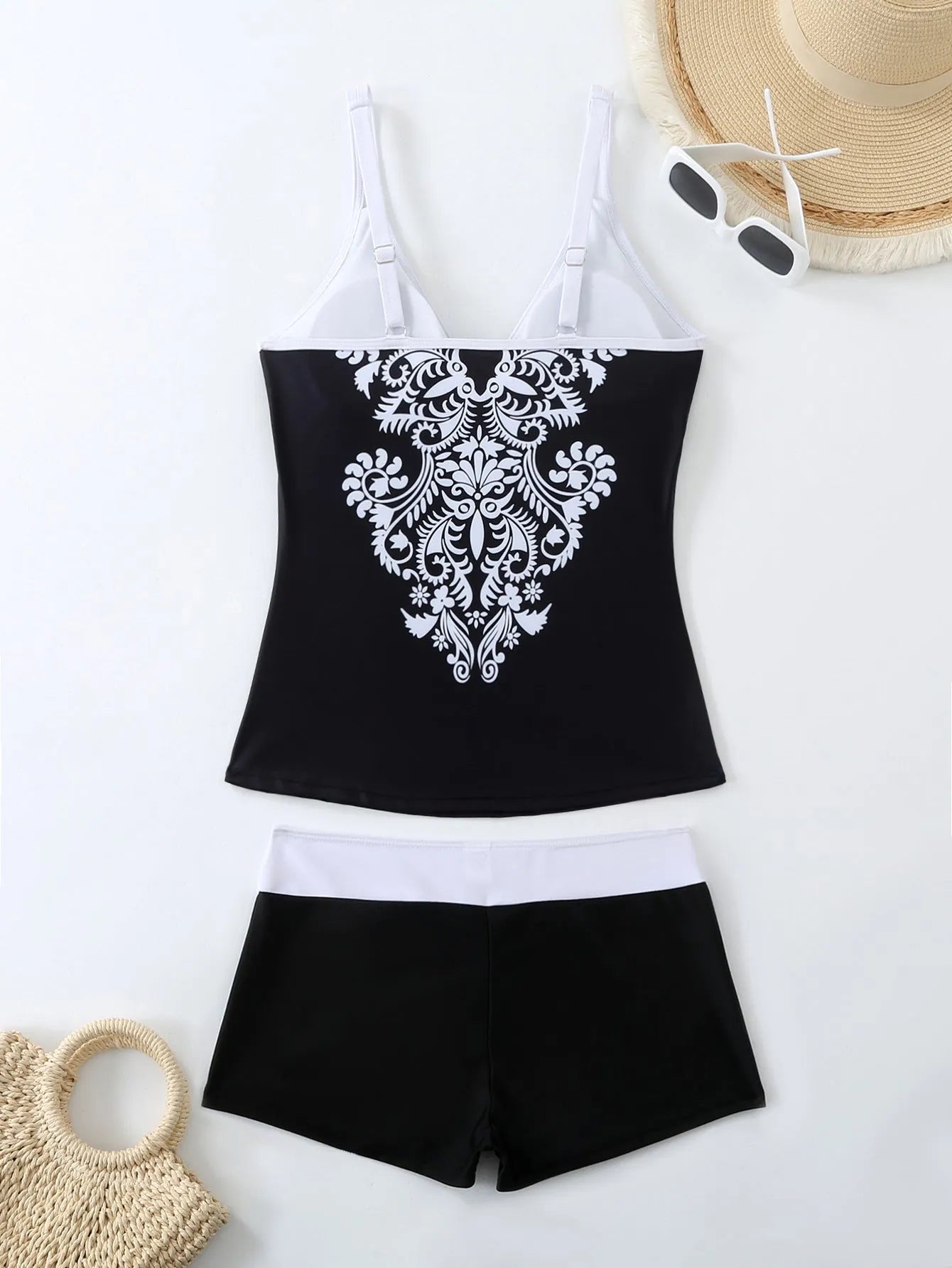 Women's plus size printed two-piece swimsuit set in black or rose red.