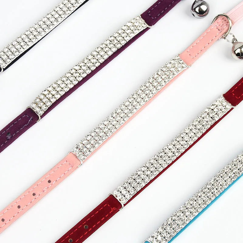 Adjustable red velvet cat collar with a silver rhinestone detail on the buckle.