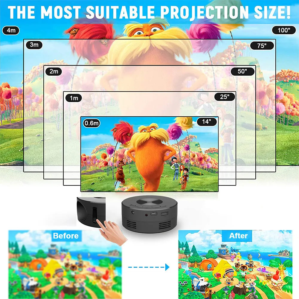 Black portable mini projector for children next to a mobile phone on a table.