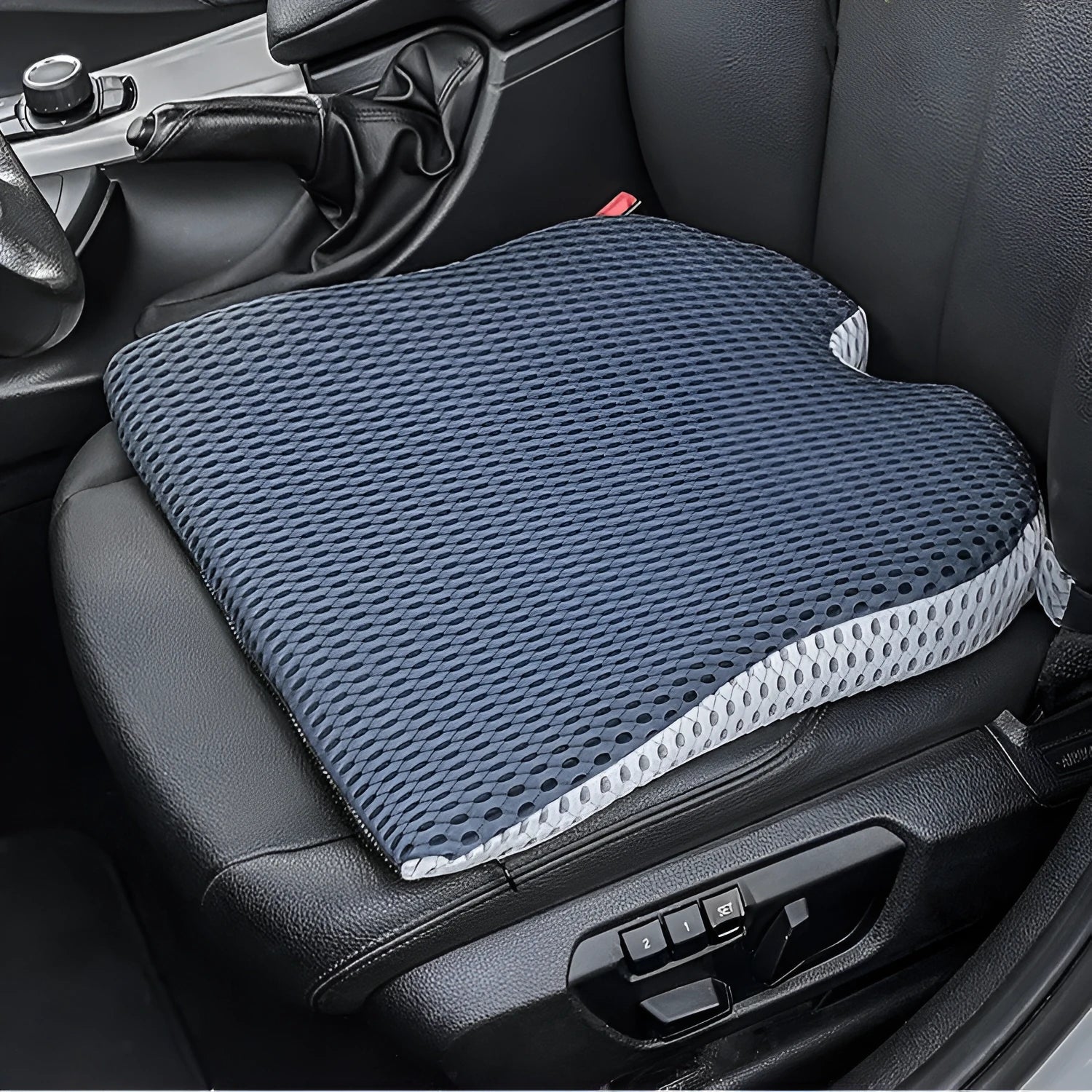 Memory foam lumbar cushion with straps on an office chair, shown in grey colour.