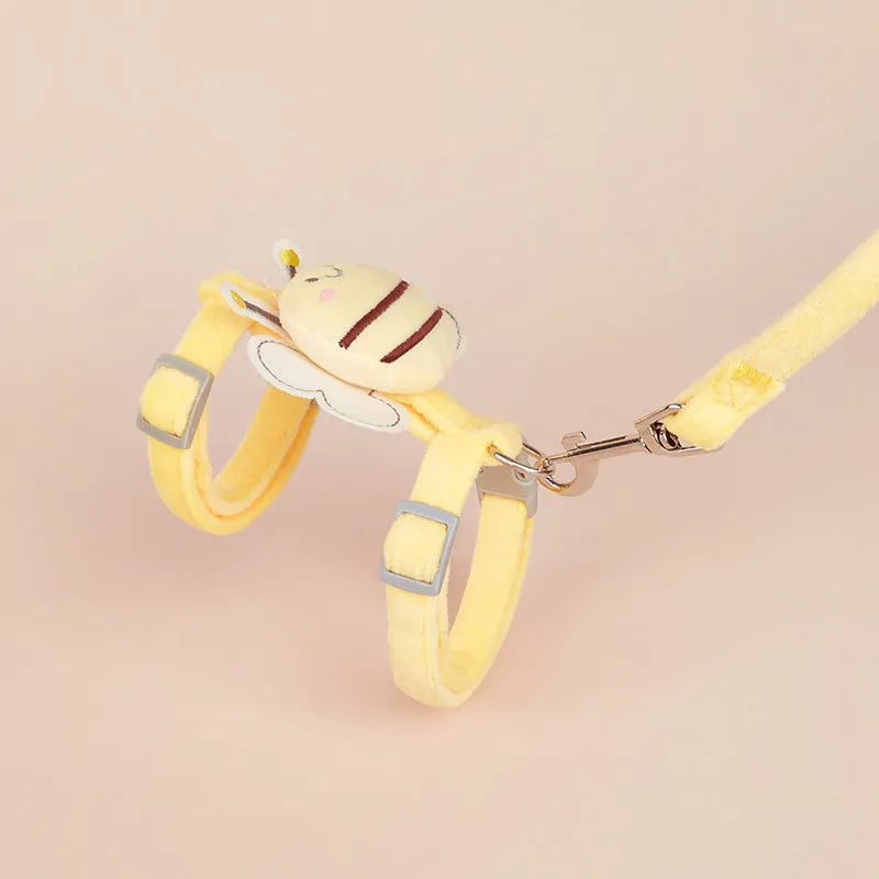 Pink teddy bee-shaped adjustable cat leash and rope on a blue background.