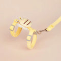 Pink teddy bee-shaped adjustable cat leash and rope on a blue background.