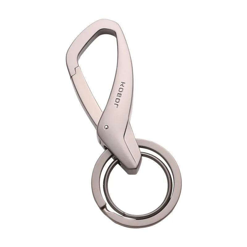 Black zinc alloy double ring key chain on a table, showing its 8.3cm length and compact design.