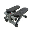 Silver grey household hydraulic pedal exercise machine for waist slimming and cardio.
