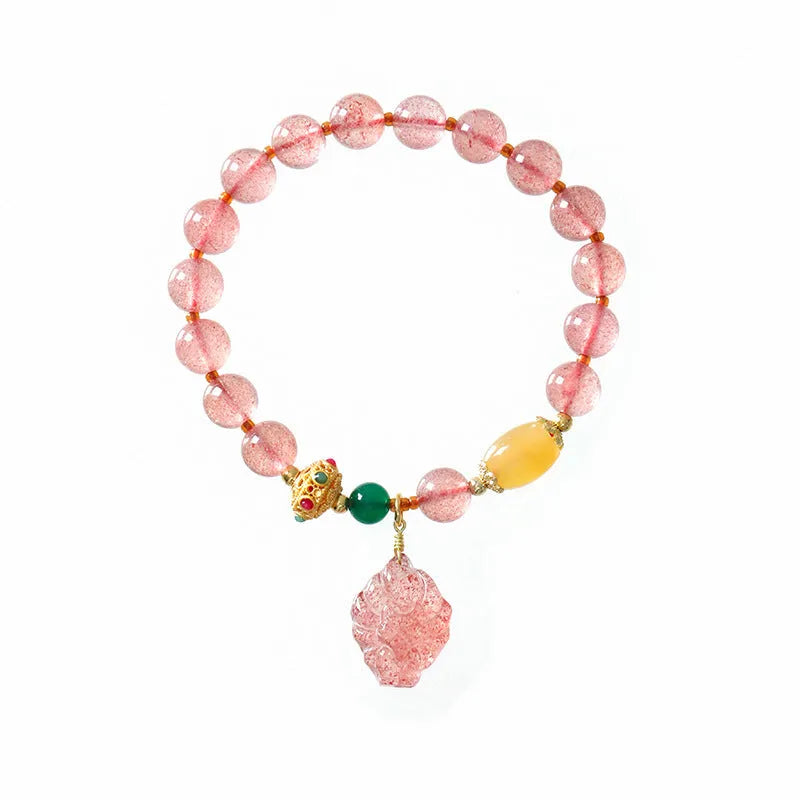 Women's polished crystal beaded bracelet with strawberry quartz and a nine-tail fox charm.