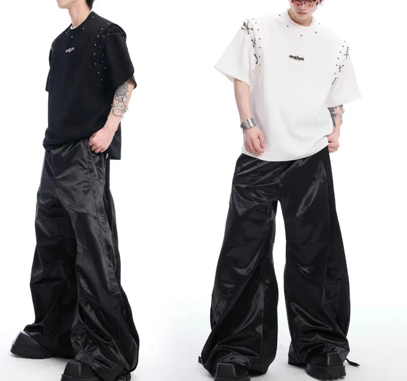 Black deconstructed short sleeve T-shirt with lace-up sides and cutout detailing on a mannequin.