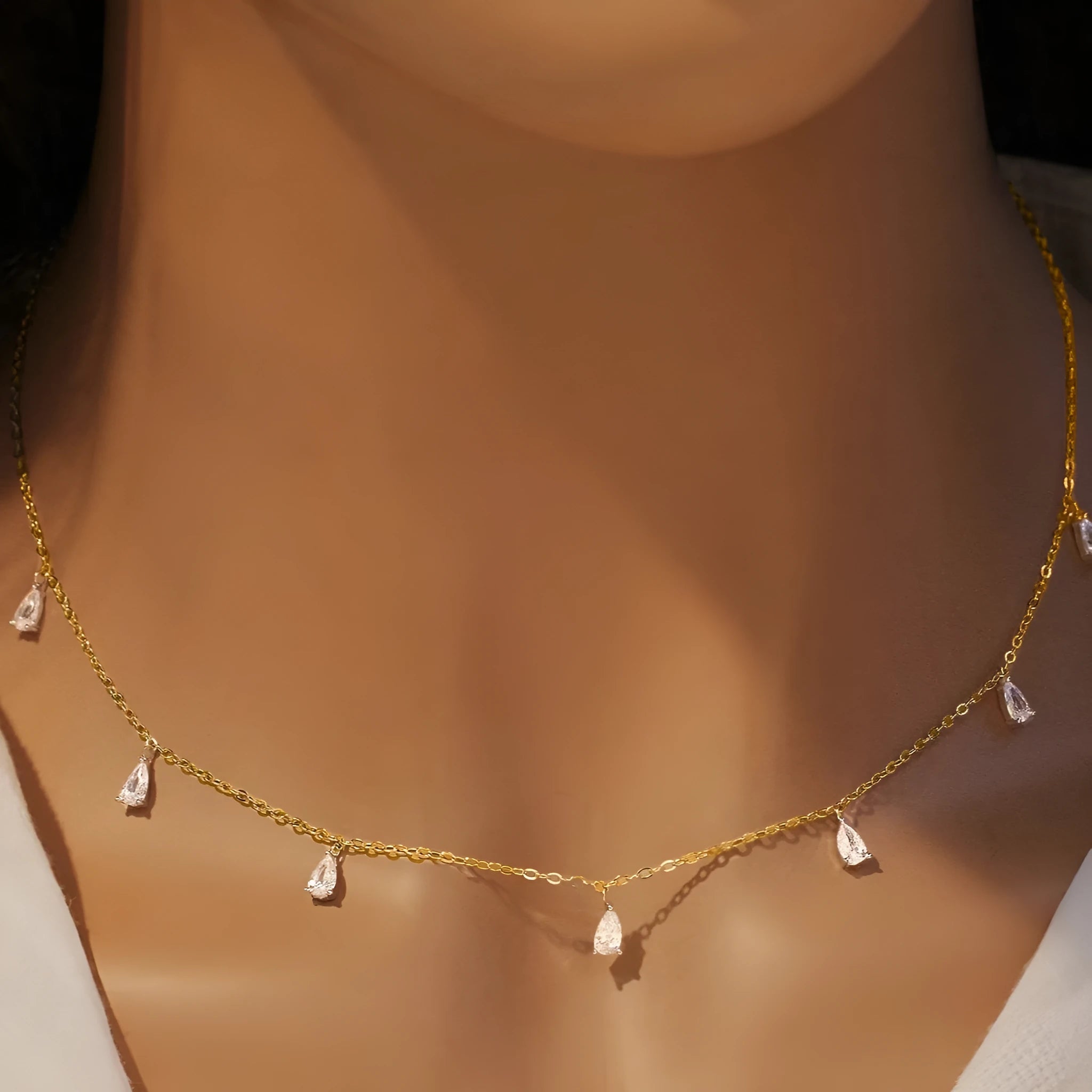 Gentle drop-shaped artificial zircon pendant on a silver O-chain necklace for women.