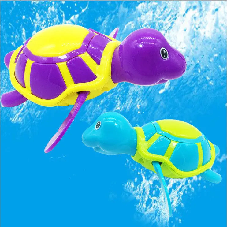 Small green plastic swimming turtle bath toy floating in water