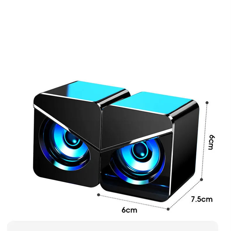 Black and white USB mini computer speakers with cable for desktop audio