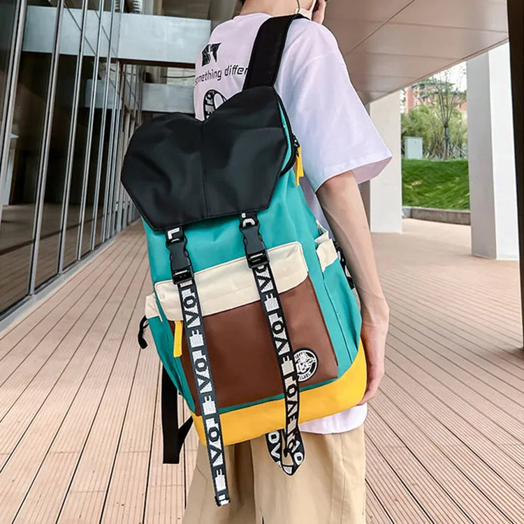 Oxford cloth backpack in black shown with handheld grip and shoulder straps.
