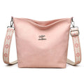 Soft grey PU crossbody bag with adjustable strap on mannequin