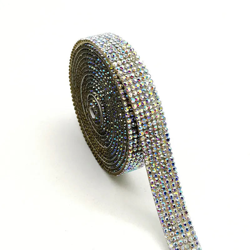 A long strip of self-adhesive glass water drills in AB colour and white, shown in different widths.