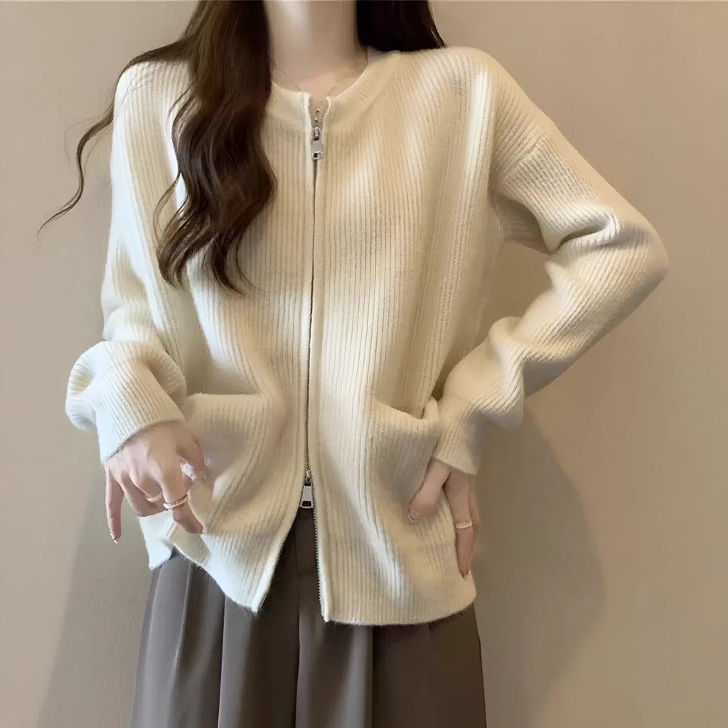 Beige viscose knit sweater coat cardigan with long sleeves laid flat.