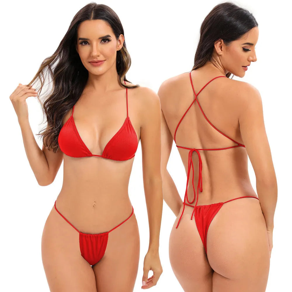 Women's candy coloured cross strap split swimsuit with multiple adjustable straps on a mannequin.