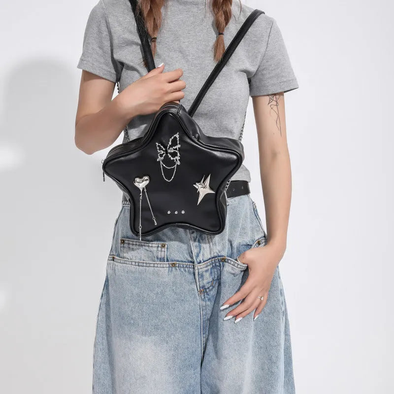 Black PU leather decorative backpack with metal butterfly love pendant and five-pointed star, chain strap.