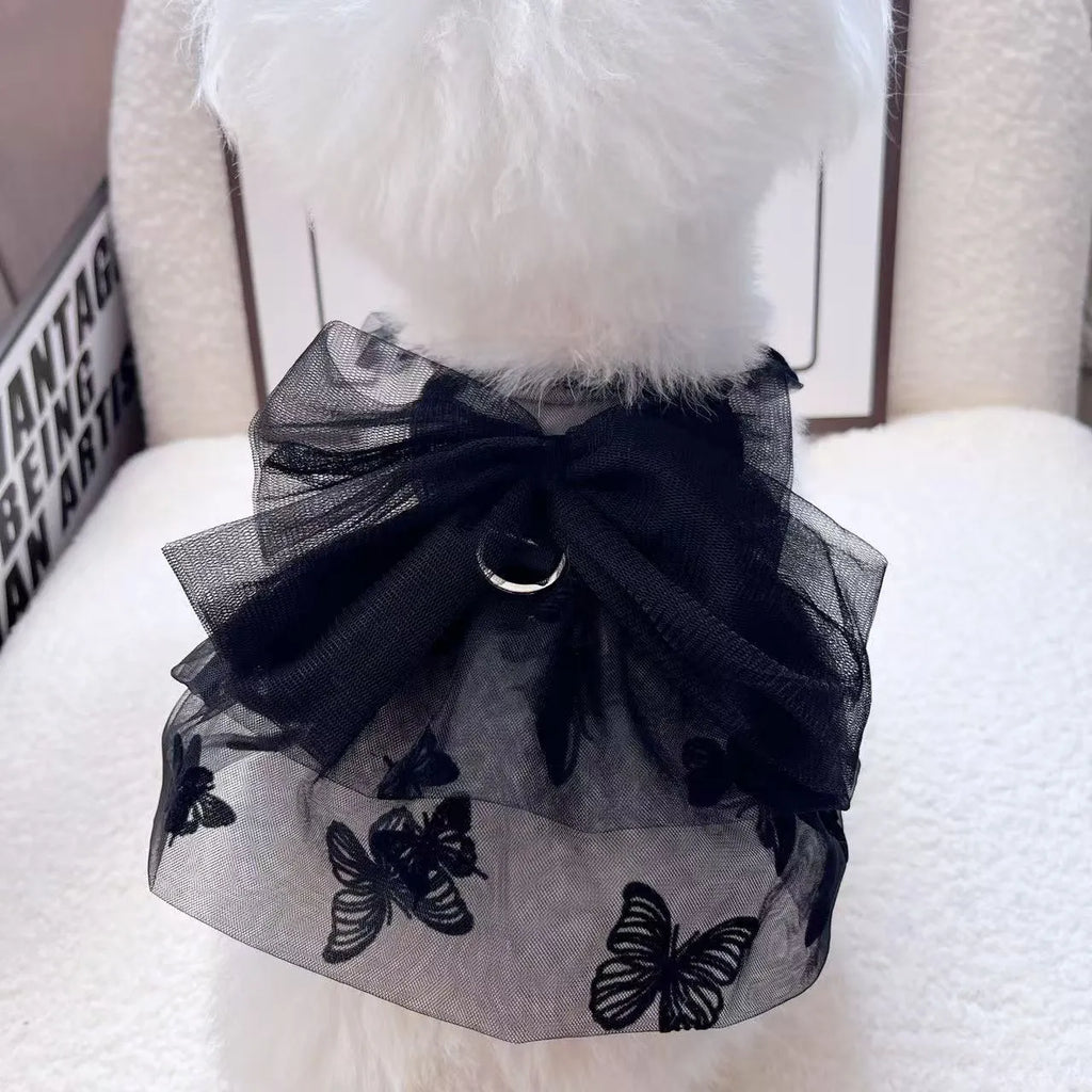 Black layered tulle princess skirt on a small dog, showing chest fit and back length.