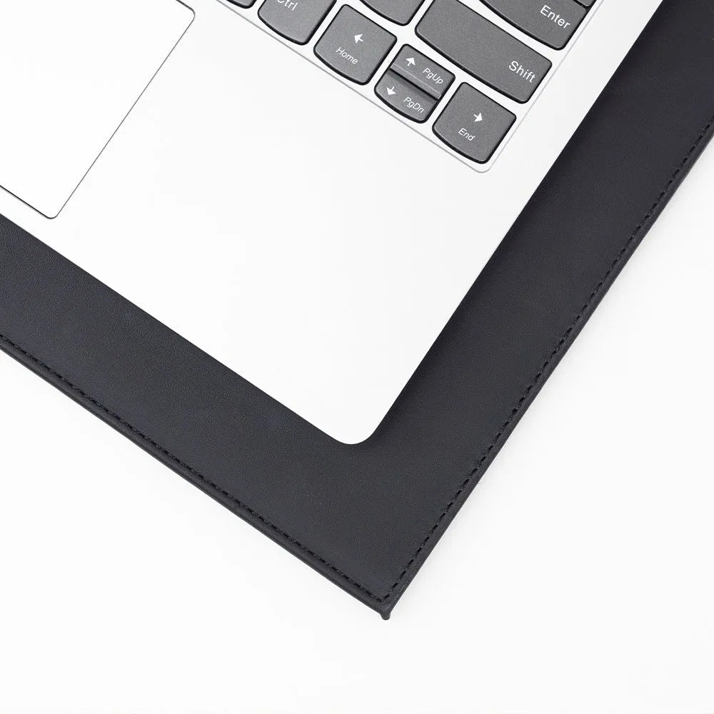Durable heat-insulating anti-radiation laptop pad in black, black gold, blue, and green colour options on a desk.