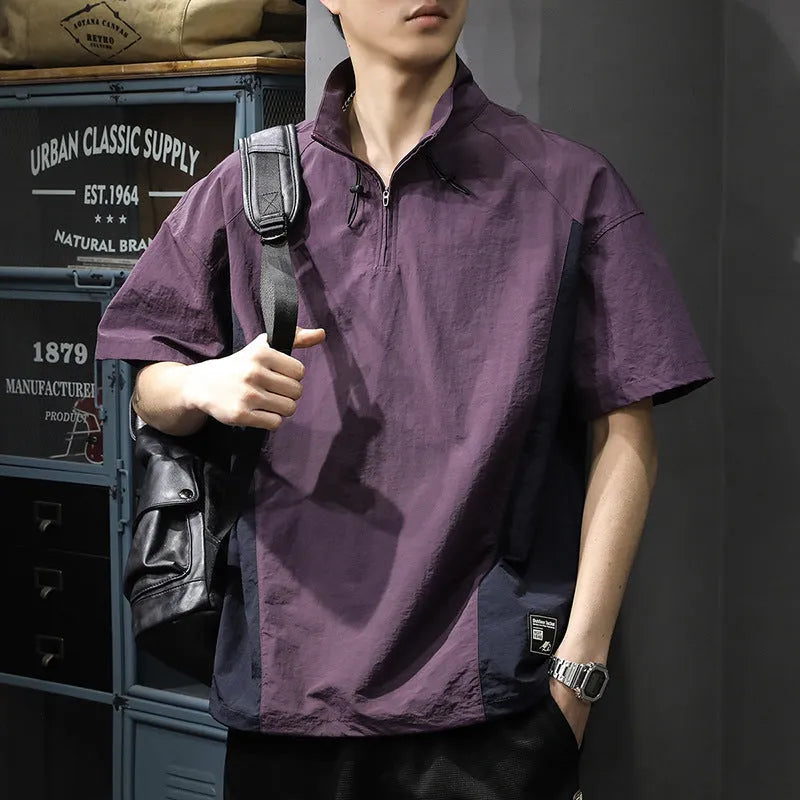 Brown men's half-zip stand collar short sleeve shirt with a fleece-lined interior on a hanger.