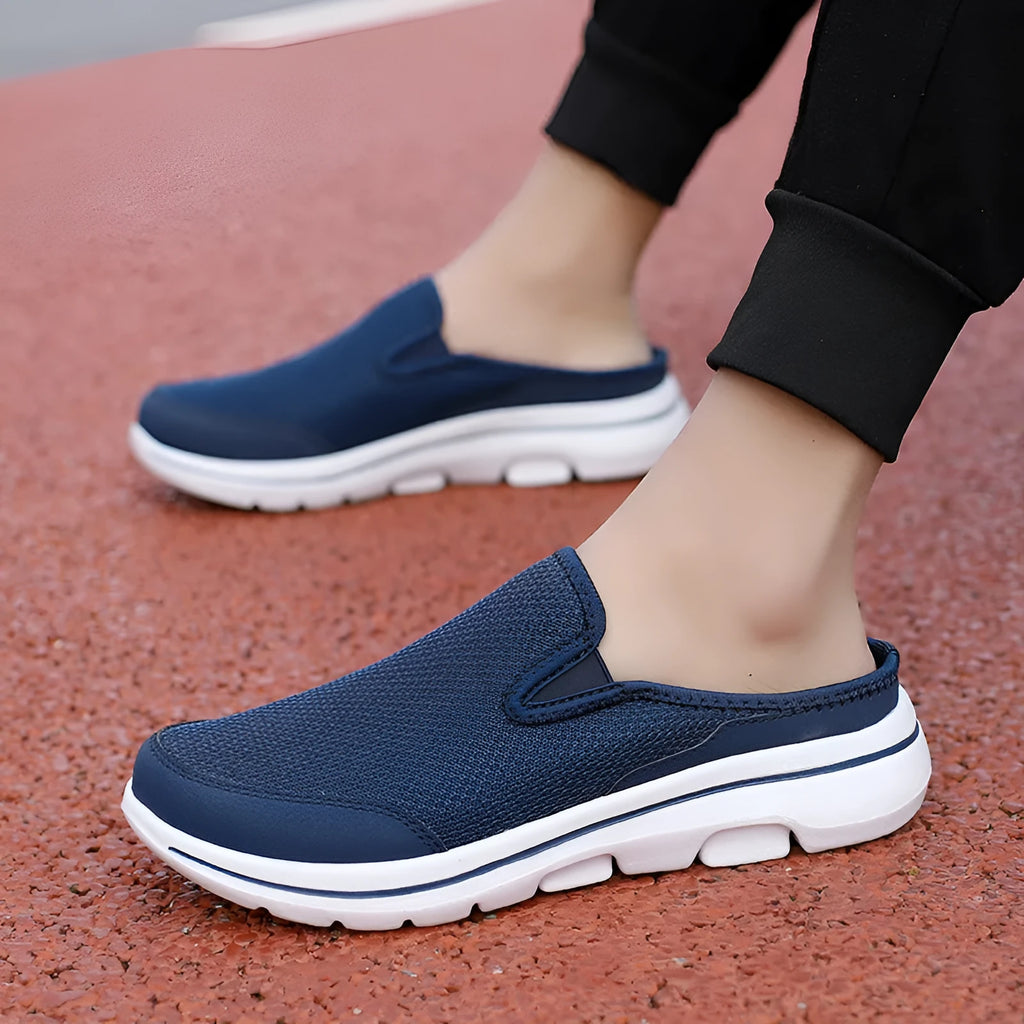 Breathable mesh toe holder slippers in solid colours on a flat heel sole.