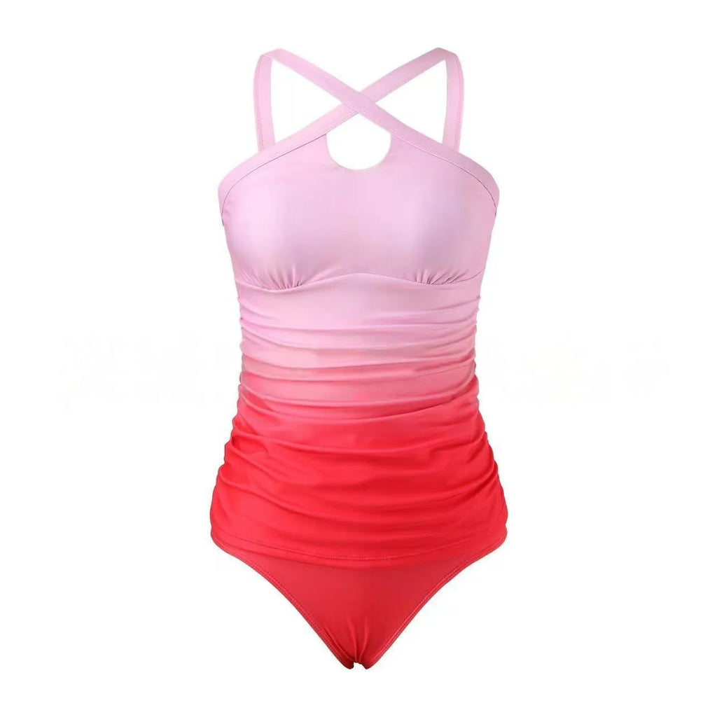 Women's gradient colour cross-strap back swimsuit with heap pleating, shown in a brief style.