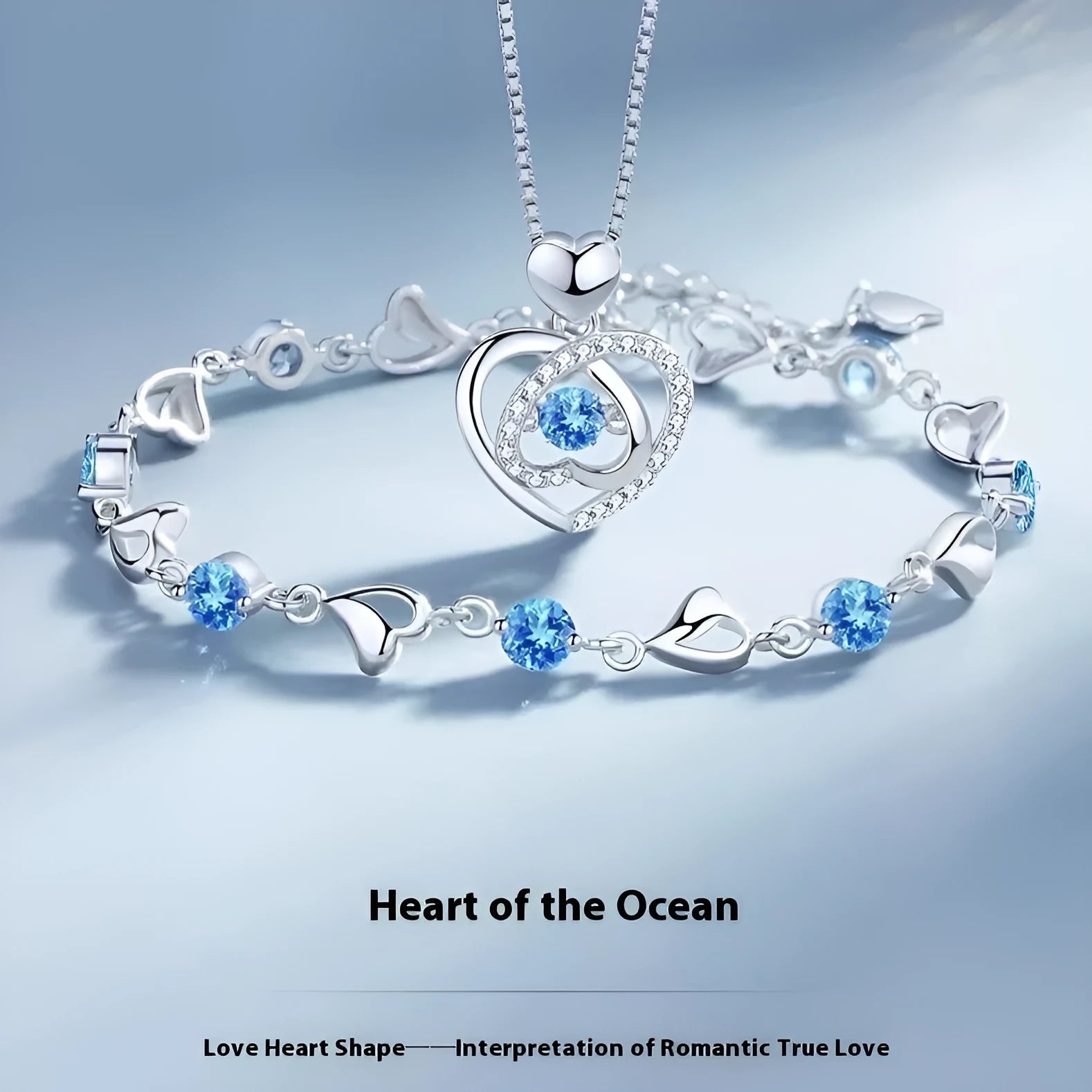 Blue diamond heart necklace and bracelet set with adjustable chain on copper background