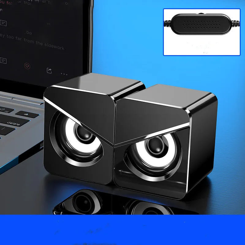 Black and white USB mini computer speakers with cable for desktop audio