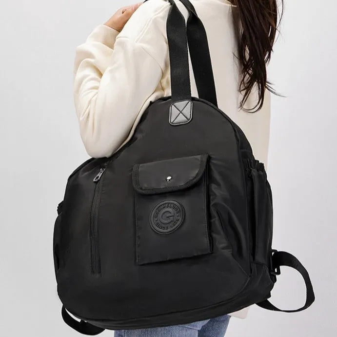 Large lightweight nylon backpack in black, shown with a sandwich pocket and main compartment.