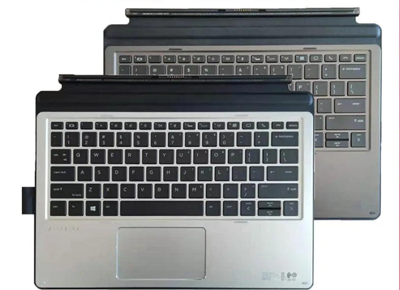 Elite X2 slim wireless keyboard with ergonomic design and multimedia keys next to a tablet.