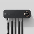 UV toothbrush holder steriliser with LED display attached to wall, showing countdown, black colour