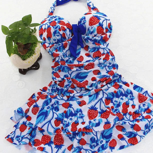 Women's blue strawberry print one-piece swimsuit with cross-strap backless design and push-up support